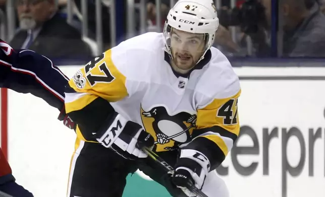 FILE - Pittsburgh Penguins forward Adam Johnson in action during an NHL hockey game in Columbus, Ohio, Sept. 22, 2017. (AP Photo/Paul Vernon, File)