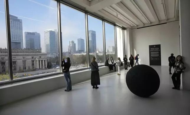 People look out of the window of the Museum of Modern Art in Warsaw, Poland, on Thursday Oct. 24, 2024. (AP Photo/Czarek Sokolowski)