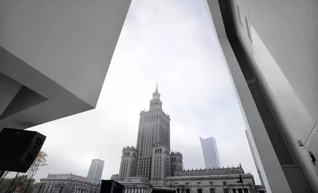 The Stalinist-era Palace of Culture and Science is seen in the background with part of the Museum of Modern Art in Warsaw, Poland, seen in the foreground on Thursday Oct. 24, 2024. (AP Photo/Czarek Sokolowski)