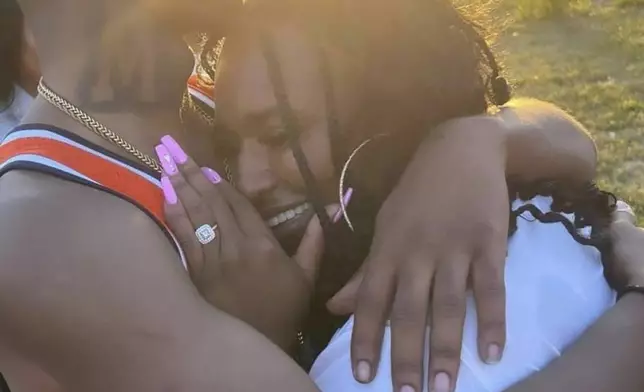 This early 2024 photo provided by Angela Phipps shows Steven Phipps, left, hugging his mom at a family gathering in Omaha, Neb. (Angela Phipps via AP)