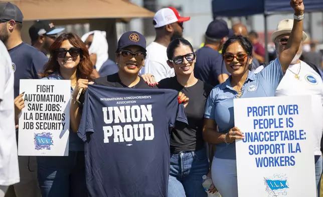 ILA members strike at the Bayport Container Terminal on Tuesday, Oct. 1, 2024, in Houston. (AP Photo/Annie Mulligan)