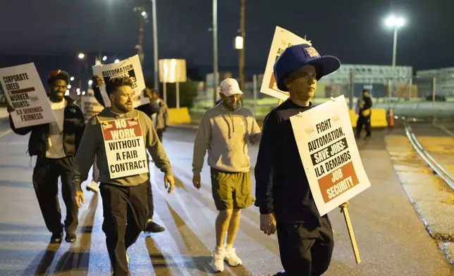 Striking Philadelphia longshoreman picket outside the Packer Avenue Marine Terminal Port, Tuesday, Oct. 1, 2024.(AP Photo/Ryan Collerd)