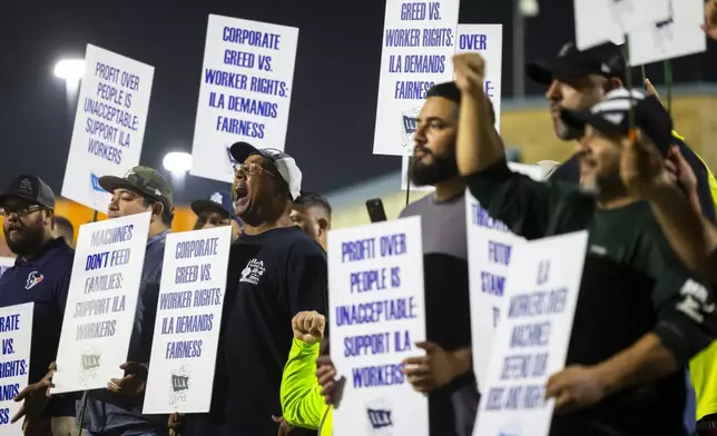 Longshoremen strike at midnight at Bayport Terminal on Tuesday, Oct. 1, 2024, in Houston. (AP Photo/Annie Mulligan)