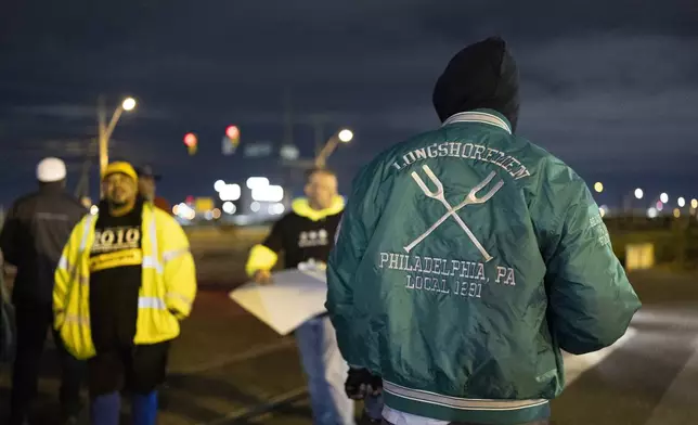 Philadelphia longshoremen assembled outside the Packer Avenue Marine Terminal Port begin to strike as their contract runs out at midnight, Tuesday, Oct. 1, 2024. (AP Photo/Ryan Collerd)