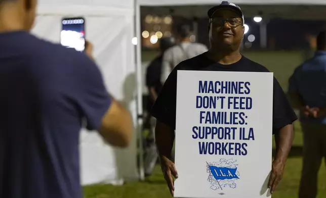 Longshoremen strike at midnight at Bayport Terminal on Tuesday, Oct. 1, 2024, in Houston. (AP Photo/Annie Mulligan)