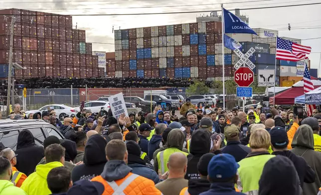 Workers take part in a port strike at Port Newark, Tuesday, Oct. 1, 2024, in Bayonne, N.J. (AP Photo/Eduardo Munoz Alvarez)