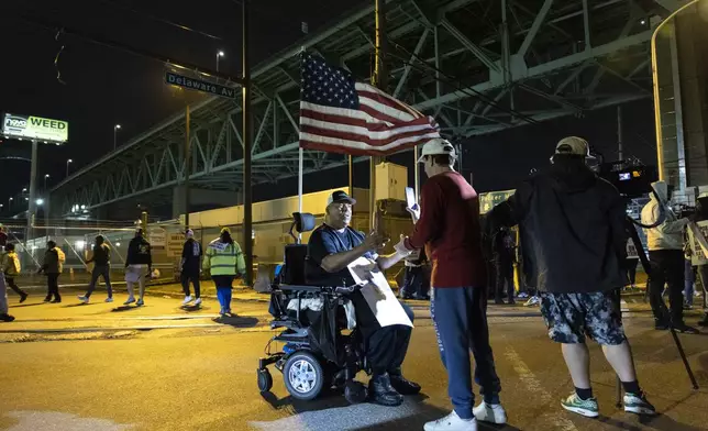 Boise Butler, president of ILA Local 1291, speaks to the press outside the Packer Avenue Marine Terminal Port in Philadelphia, Tuesday, Oct. 1, 2024. (AP Photo/Ryan Collerd)