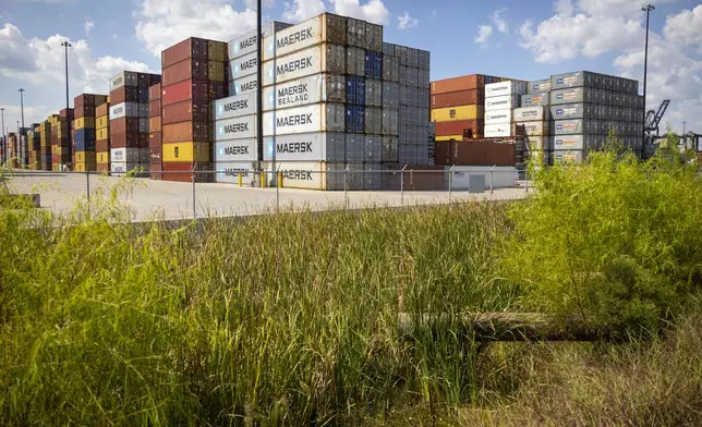 Stacked containers line the Bayport Container Terminal during the first day of a dockworkers strike on Tuesday, Oct. 1, 2024, in Houston. (AP Photo/Annie Mulligan)