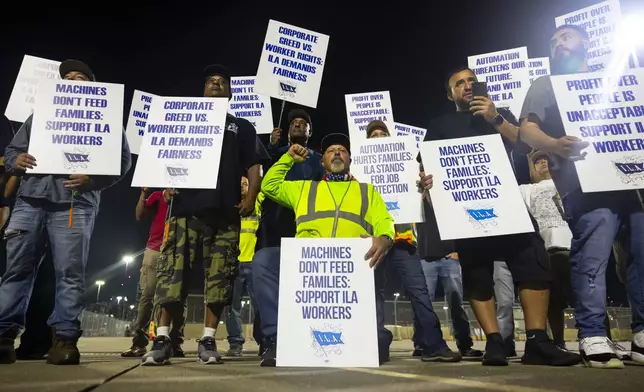 Longshoremen strike at midnight at Bayport Terminal on Tuesday, Oct. 1, 2024, in Houston. (AP Photo/Annie Mulligan)