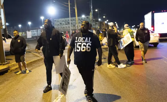 Philadelphia longshoremen assembled outside the Packer Avenue Marine Terminal Port begin to strike as their contract runs out at midnight, Tuesday, Oct. 1, 2024. (AP Photo/Ryan Collerd)