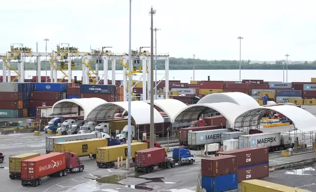 Trucks line up at Port Miami Friday, Oct. 4, 2024, in Miami. (AP Photo/Marta Lavandier)