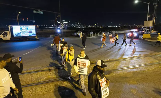 Striking Philadelphia longshoremen picket outside the Packer Avenue Marine Terminal Port, Tuesday, Oct. 1, 2024. (AP Photo/Ryan Collerd)