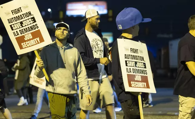 Striking Philadelphia longshoreman picket outside the Packer Avenue Marine Terminal Port, Tuesday, Oct. 01, 2024.(AP Photo/Ryan Collerd)