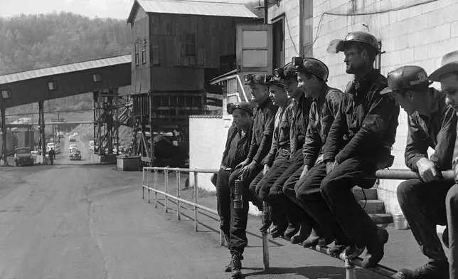 FILE - Miners at the Slabfork Coal company in West Virginia wait for ride home after work, May 6, 1960. (AP Photo, File)