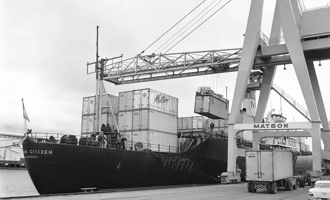 FILE - Cargo containers which can be hoisted from trucks to and from ships are loaded aboard the Matson Hawaiian Citizen at a San Francisco pier on May 15, 1963. (AP Photo, File)