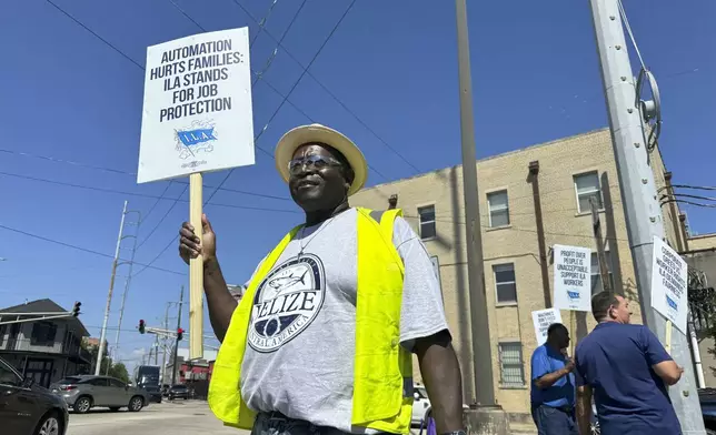 Striking International Longshoremen's Association dockworker Henderson Wilson, 61, stands on the picket line near the Port of New Orleans in Louisiana, Tuesday, Oct. 1, 2024. (AP Photo/Jack Brook)