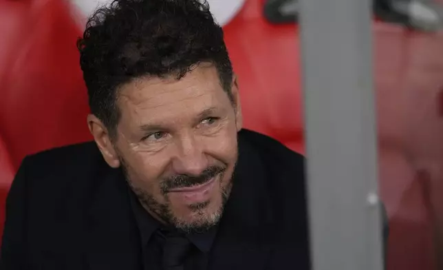 Atletico Madrid's head coach Diego Simeone looks on before the kick off of a Champions League opening phase soccer match between SL Benfica and Atletico Madrid in Lisbon, on Wednesday, Oct. 2, 2024.(AP Photo/Armando Franca)