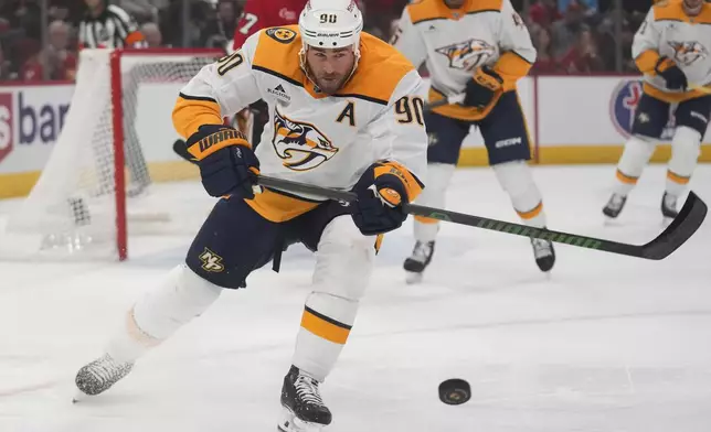 Nashville Predators center Ryan O'Reilly clears the puck out of his zone during the first period of an NHL hockey game against the Chicago Blackhawks, Friday, Oct. 25, 2024, in Chicago. (AP Photo/Erin Hooley)