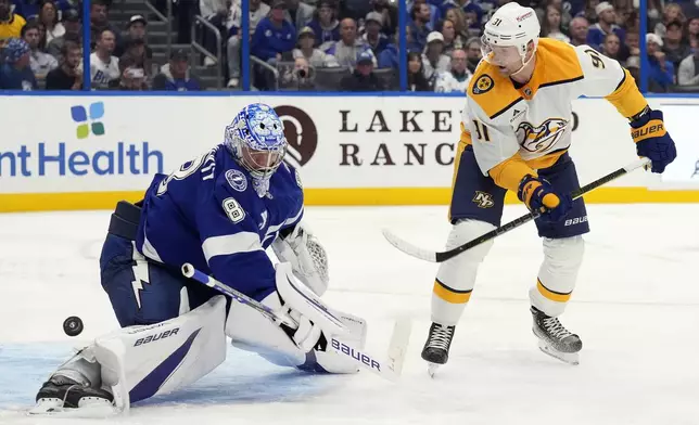 Nashville Predators center Steven Stamkos (91) shoots wide of Tampa Bay Lightning goaltender Andrei Vasilevskiy (88) during the third period of an NHL hockey game Monday, Oct. 28, 2024, in Tampa, Fla. (AP Photo/Chris O'Meara)