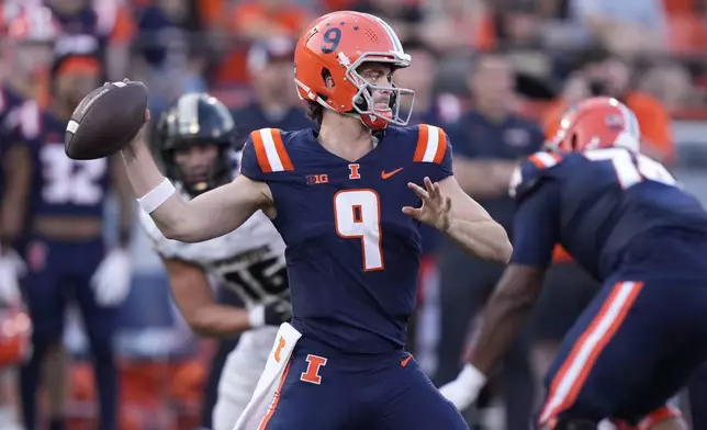 Illinois quarterback Luke Altmyer passes during the second half of an NCAA college football game against Purdue on Saturday, Oct. 12, 2024, in Champaign, Ill. (AP Photo/Charles Rex Arbogast)