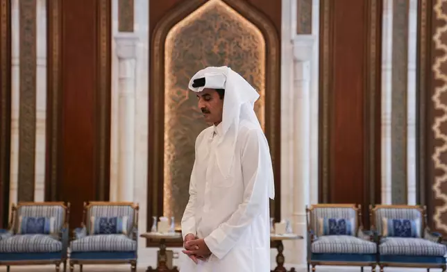 Qatar's Emir Sheikh Tamim bin Hamad al-Thani waits to receive U.S. Secretary of State Antony Blinken, in Doha, Qatar, Thursday, Oct. 24, 2024. (Nathan Howard/Pool Photo via AP)