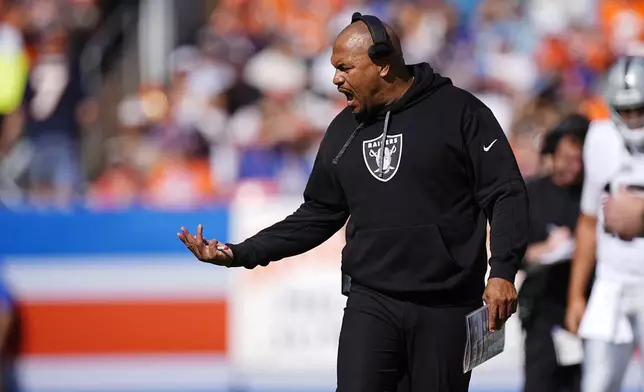 Las Vegas Raiders head coach Antonio Pierce reacts on the sideline during the first half of an NFL football game against the Denver Broncos, Sunday, Oct. 6, 2024, in Denver. (AP Photo/David Zalubowski)