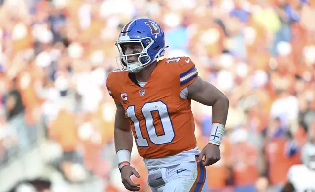 Denver Broncos quarterback Bo Nix runs to the sideline during the second half of an NFL football game against the Las Vegas Raiders, Sunday, Oct. 6, 2024, in Denver. (AP Photo/Geneva Heffernan)