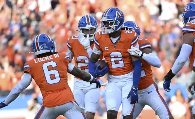 Denver Broncos cornerback Pat Surtain II (2) celebrates after a play during the second half of an NFL football game against the Las Vegas Raiders, Sunday, Oct. 6, 2024, in Denver. (AP Photo/Geneva Heffernan)