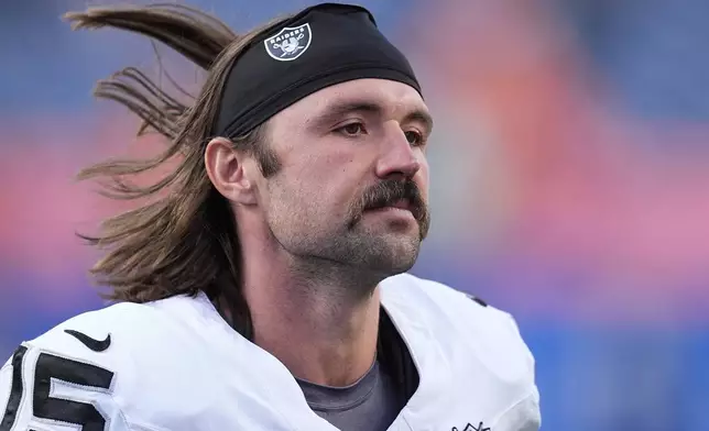 Las Vegas Raiders quarterback Gardner Minshew walks off the field after the second half of an NFL football game against the Denver Broncos Sunday, Oct. 6, 2024, in Denver. (AP Photo/David Zalubowski)