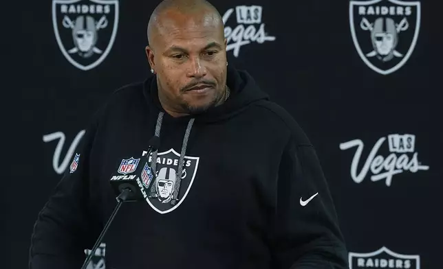 Las Vegas Raiders head coach Antonio Pierce responds to a question after an NFL football game, Sunday, Oct. 6, 2024, in Denver. (AP Photo/David Zalubowski)