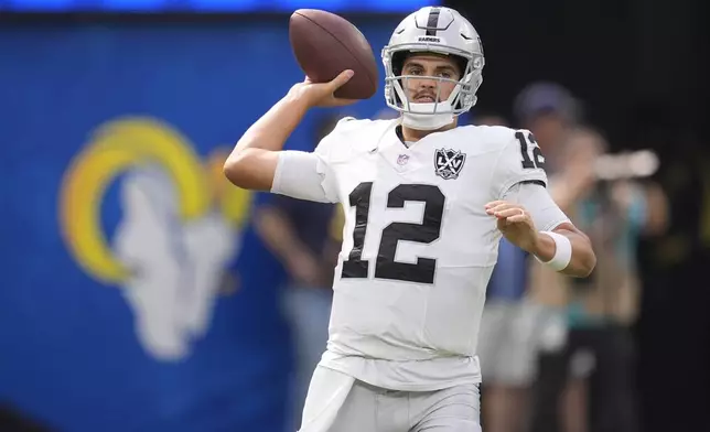 Las Vegas Raiders quarterback Aidan O'Connell warms up before an NFL football game against the Los Angeles Rams, Sunday, Oct. 20, 2024, in Inglewood, Calif. (AP Photo/Marcio Jose Sanchez)