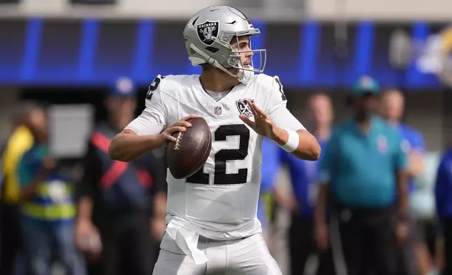 Las Vegas Raiders quarterback Aidan O'Connell (12) looks to pass during the first half of an NFL football game against the Los Angeles Rams, Sunday, Oct. 20, 2024, in Inglewood, Calif. (AP Photo/Marcio Jose Sanchez)