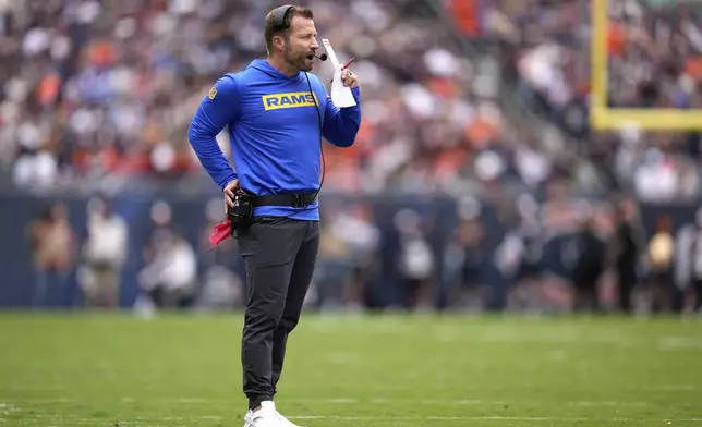 Los Angeles Rams head coach Sean McVay calls in a play during the second half of an NFL football game against the Chicago Bears on Sunday, Sept. 29, 2024, in Chicago. (AP Photo/Erin Hooley)