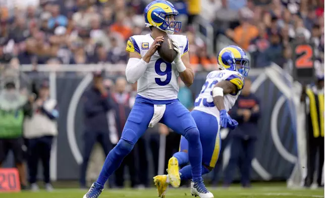 Los Angeles Rams quarterback Matthew Stafford sets up to pass during the first half of an NFL football game against the Chicago Bears on Sunday, Sept. 29, 2024, in Chicago. (AP Photo/Erin Hooley)