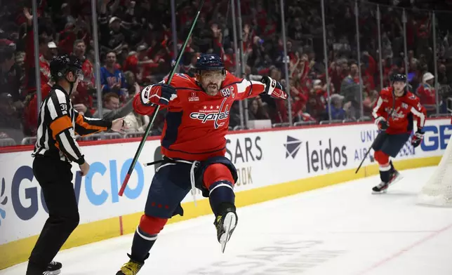 Washington Capitals left wing Alex Ovechkin celebrates his second goal of the game during the first period of an NHL hockey game against the New York Rangers, Tuesday, Oct. 29, 2024, in Washington. (AP Photo/Nick Wass)
