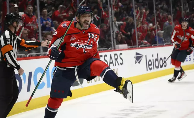 Washington Capitals left wing Alex Ovechkin celebrates his second goal of the game during the first period of an NHL hockey game against the New York Rangers, Tuesday, Oct. 29, 2024, in Washington. (AP Photo/Nick Wass)