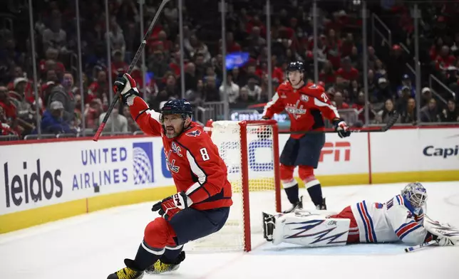 Washington Capitals left wing Alex Ovechkin (8) celebrates his second goal of the game during the first period of an NHL hockey game against New York Rangers goaltender Igor Shesterkin, Tuesday, Oct. 29, 2024, in Washington. (AP Photo/Nick Wass)