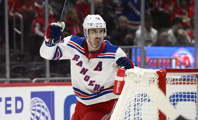 New York Rangers left wing Chris Kreider (20) celebrates his goal during the second period of an NHL hockey game against the Washington Capitals, Tuesday, Oct. 29, 2024, in Washington. (AP Photo/Nick Wass)