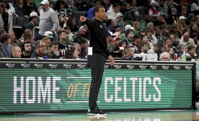 Boston Celtics head coach Joe Mazzulla calls plays during the second half of a preseason NBA basketball game against the Toronto Raptors, Sunday, Oct. 13, 2024, in Boston. (AP Photo/Mark Stockwell)