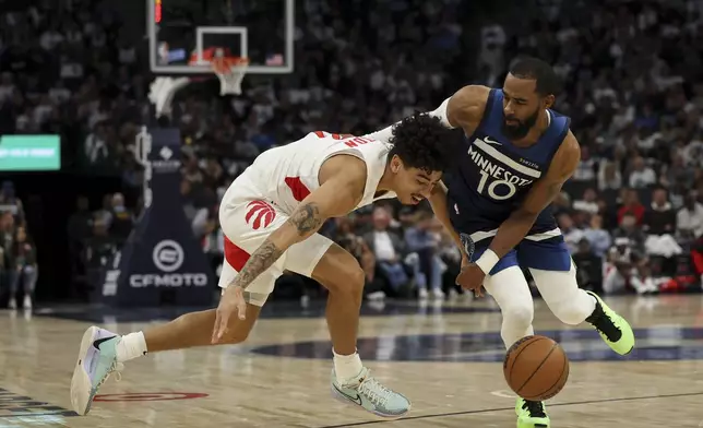Toronto Raptors guard D.J. Carton (3) struggles for a loose ball against Minnesota Timberwolves guard Mike Conley (10) during the first half of an NBA basketball game, Saturday, Oct. 26, 2024, in Minneapolis. (AP Photo/Ellen Schmidt)