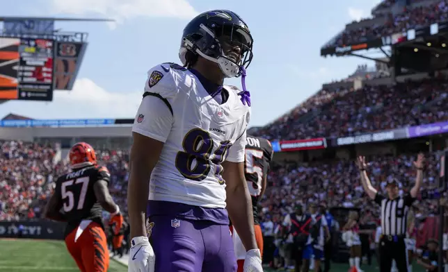 Baltimore Ravens tight end Isaiah Likely reacts after making a touchdown catch against the Cincinnati Bengals during the second half of an NFL football game, Sunday, Oct. 6, 2024, in Cincinnati. (AP Photo/Jeff Dean)