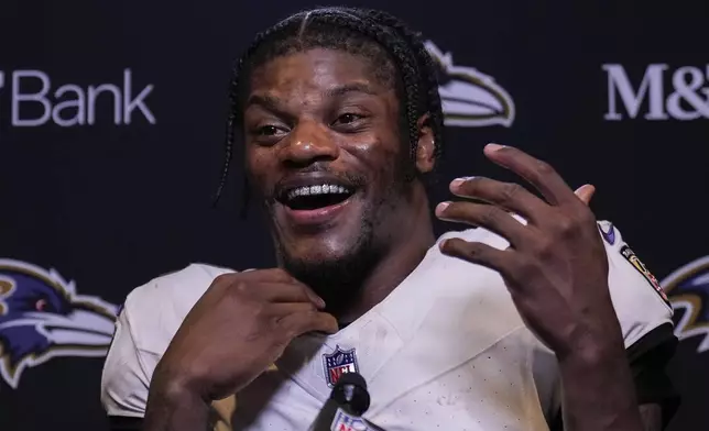 Baltimore Ravens quarterback Lamar Jackson speaks to reporters following an NFL football game against the Cincinnati Bengals, Sunday, Oct. 6, 2024, in Cincinnati. The Ravens won 41-38 in overtime. (AP Photo/Carolyn Kaster)