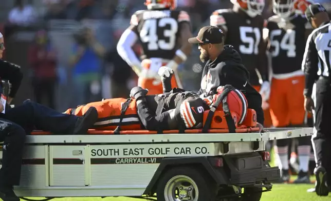 Cleveland Browns linebacker Jeremiah Owusu-Koramoah (6) is taken off the field during the second half of an NFL football game against the Baltimore Ravens in Cleveland, Sunday, Oct. 27, 2024. (AP Photo/David Richard)