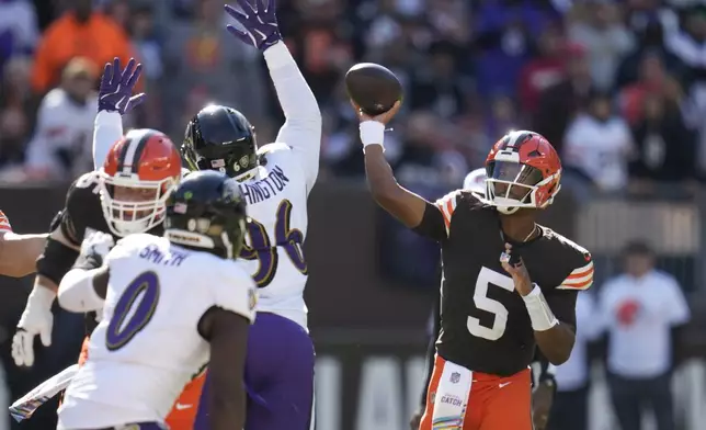 Cleveland Browns quarterback Jameis Winston (5) throws over Baltimore Ravens defensive tackle Broderick Washington (96) during the first half of an NFL football game in Cleveland, Sunday, Oct. 27, 2024. (AP Photo/Sue Ogrocki)