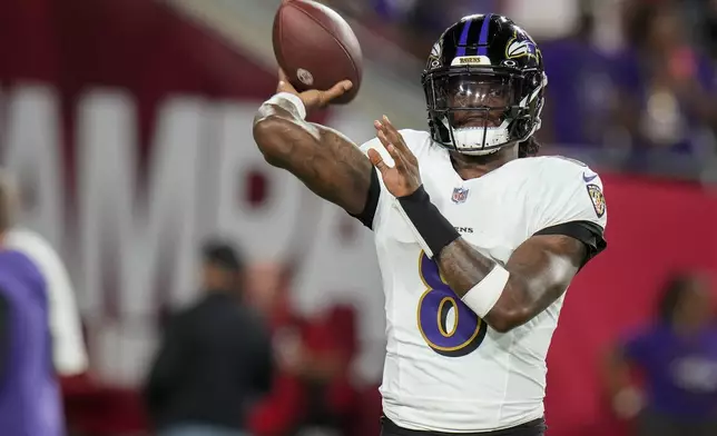 Baltimore Ravens quarterback Lamar Jackson (8) warms up before an NFL football game against the Tampa Bay Buccaneers, Monday, Oct. 21, 2024, in Tampa, Fla. (AP Photo/Chris O'Meara)