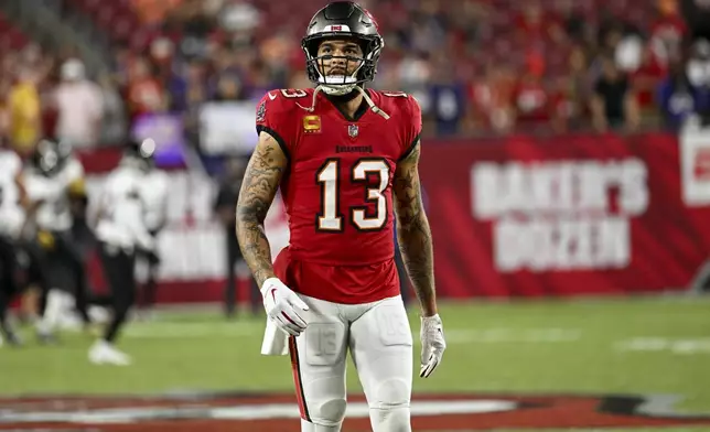 Tampa Bay Buccaneers wide receiver Mike Evans (13) warms up before an NFL football game against the Baltimore Ravens, Monday, Oct. 21, 2024, in Tampa, Fla. (AP Photo/Jason Behnken)