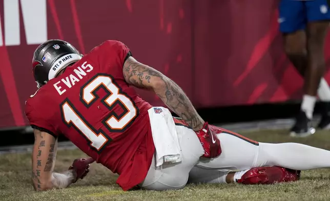 Tampa Bay Buccaneers wide receiver Mike Evans (13) reacts to an injury during the first half of an NFL football game against the Baltimore Ravens, Monday, Oct. 21, 2024, in Tampa, Fla. (AP Photo/Chris O'Meara)