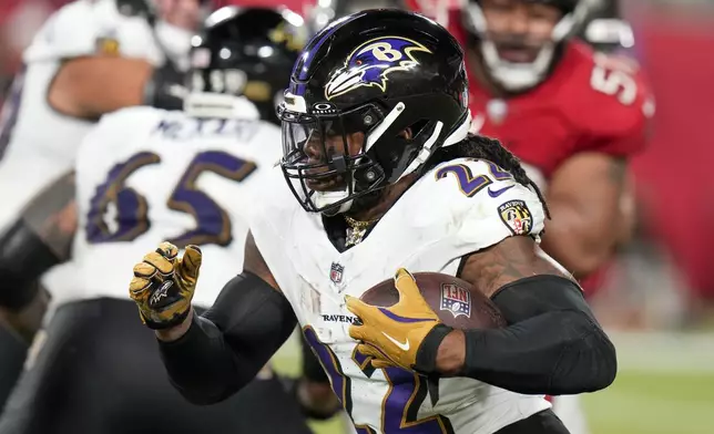 Baltimore Ravens running back Derrick Henry (22) runs the ball against the Tampa Bay Buccaneers during the second half of an NFL football game, Monday, Oct. 21, 2024, in Tampa, Fla. (AP Photo/Chris O'Meara)