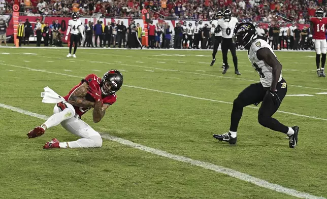 Tampa Bay Buccaneers wide receiver Mike Evans (13) scores a touchdown against the Baltimore Ravens during the first half of an NFL football game, Monday, Oct. 21, 2024, in Tampa, Fla. (AP Photo/Jason Behnken)