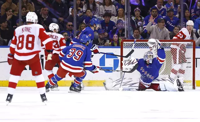 New York Rangers goaltender Igor Shesterkin makes a glove save against the Detroit Red Wings during the second period of a hockey game, Monday, Oct. 14, 2024, in New York. (AP Photo/Noah K. Murray)